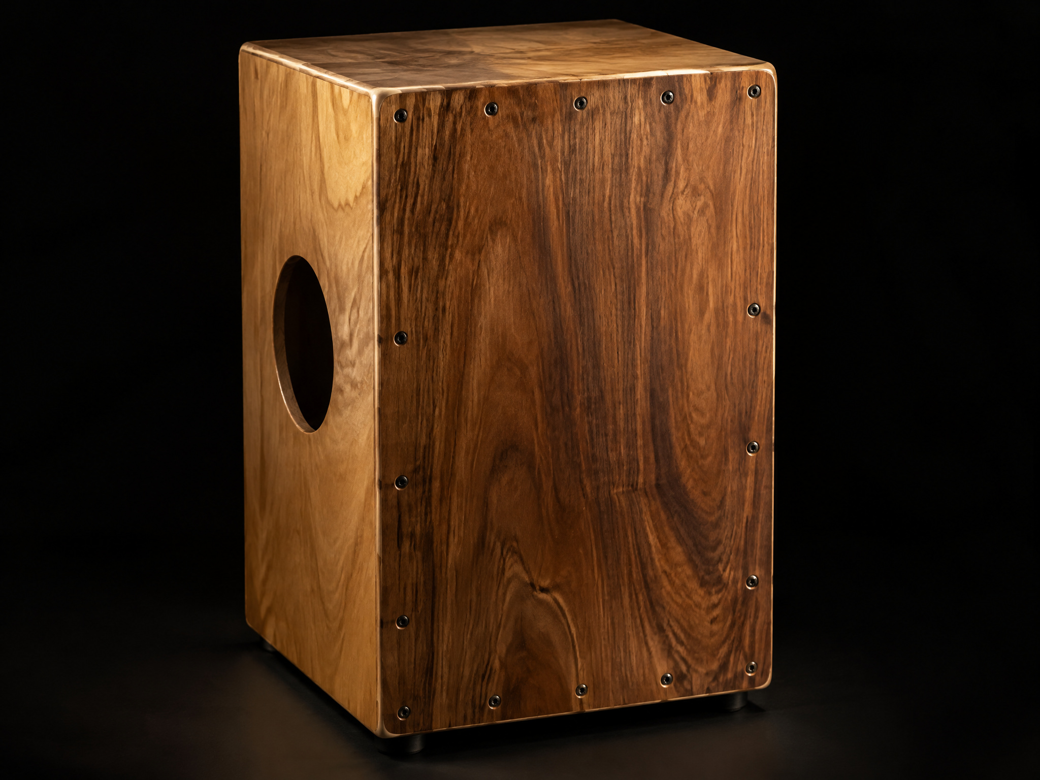 Wooden cajon box drum on a black background